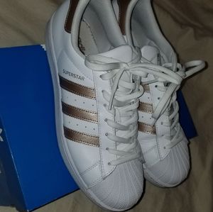 Rose gold and white Adidas superstar